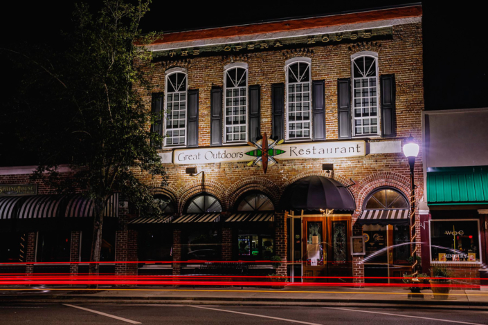Outside building at night.