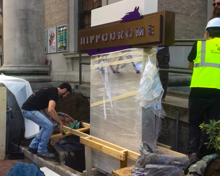 ThemeWorks employee working on Hippodrome display.