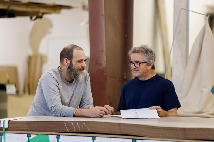 Two ThemeWorks team members discussing work plans.